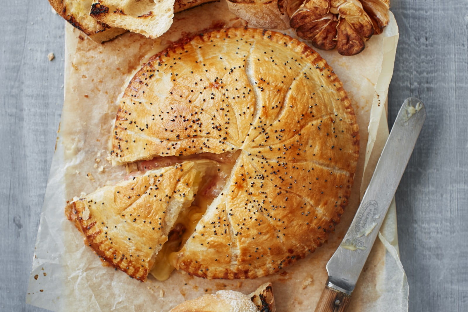 Puff pastry baked–Camembert  with quince and roasted garlic