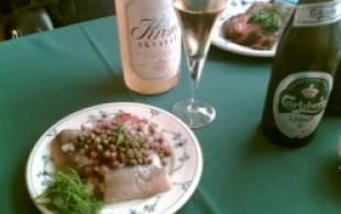 Pickled herrings with lager and akvavit