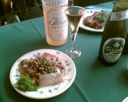 Pickled herrings with lager and akvavit