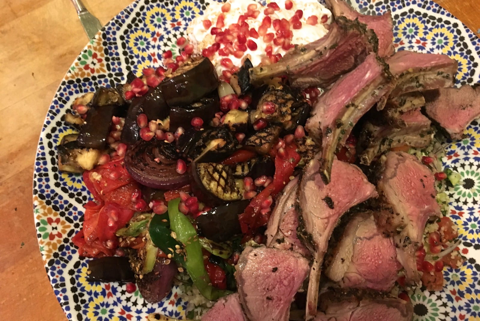 Middle eastern-style lamb with grilled vegetables and a natural red wine