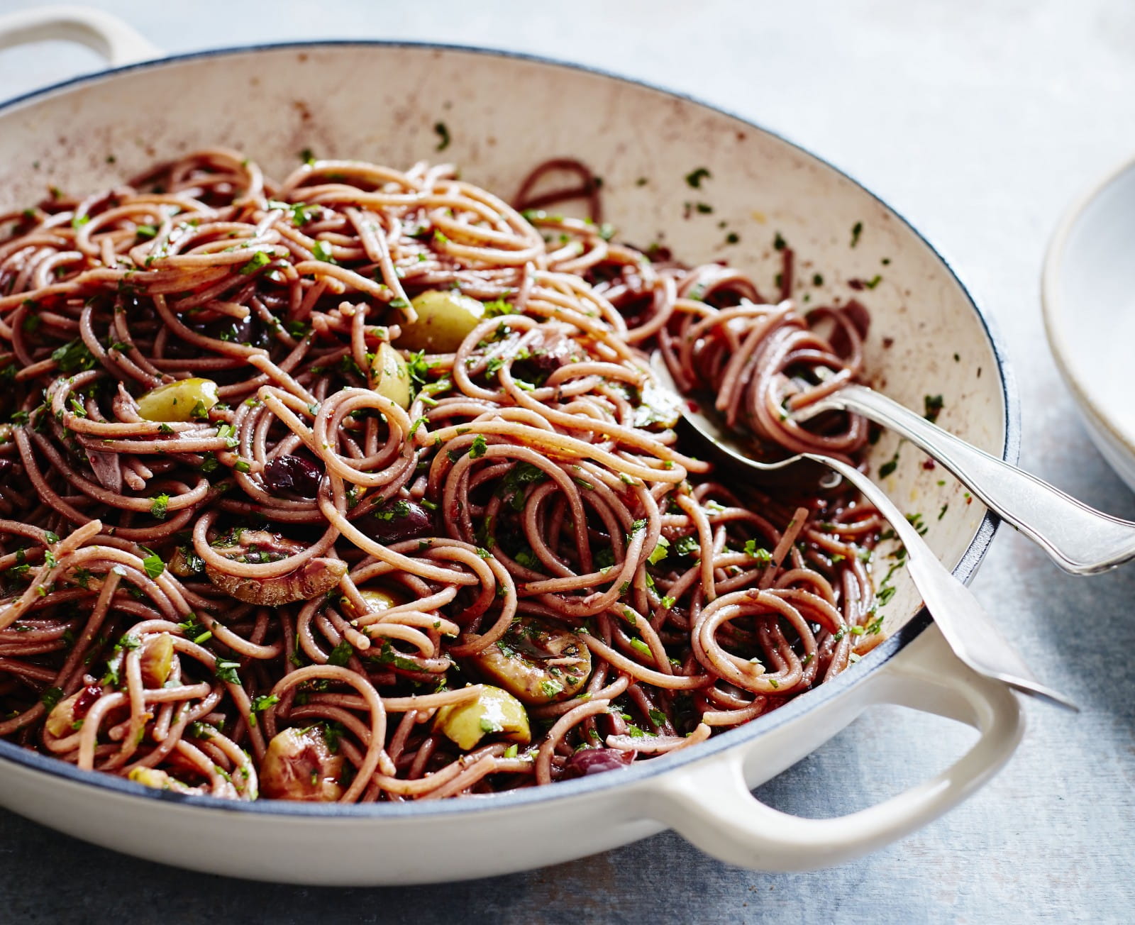 Red wine spaghetti with olives and anchovies