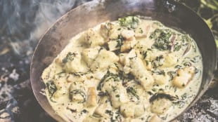 Smoky fish with spinach, gnocchi, cream and mustard