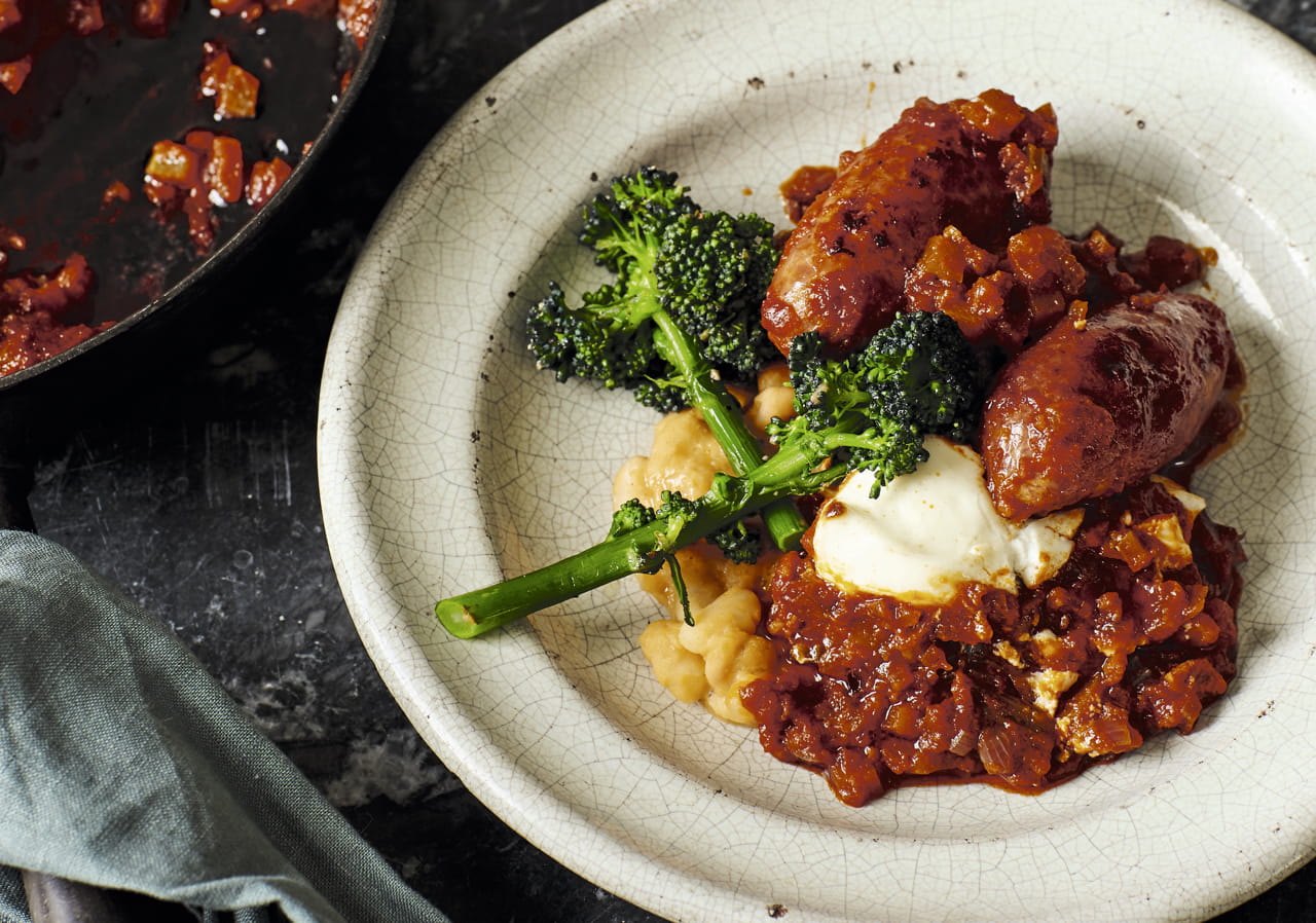 Roasted Italian sausages with borlotti beans and ’nduja sauce