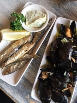 Fried sprats and grower champagne