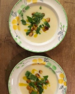 White onion and bay leaf soup with Ogleshield and hazelnuts