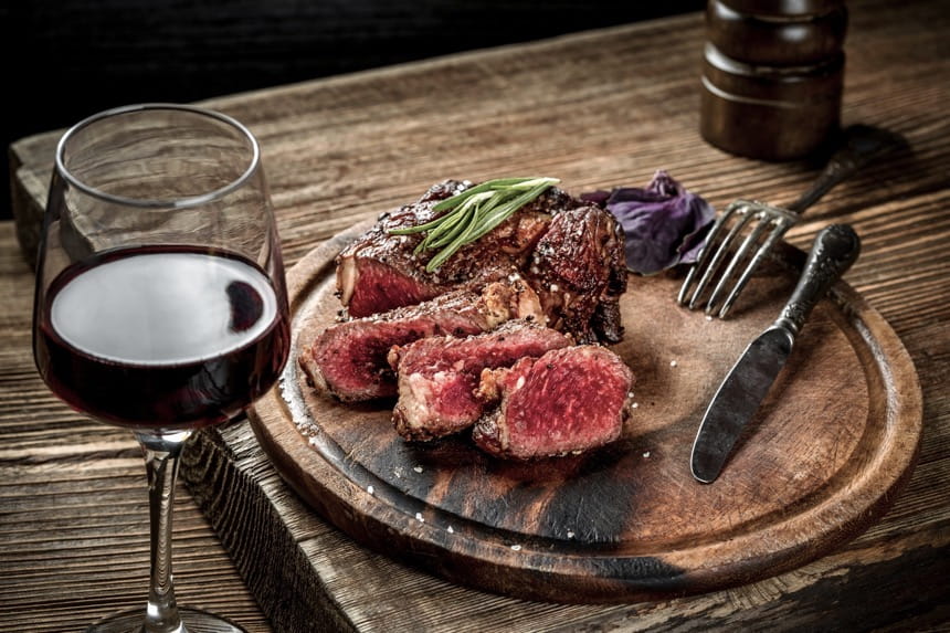 Grilled ribeye steak with red wine